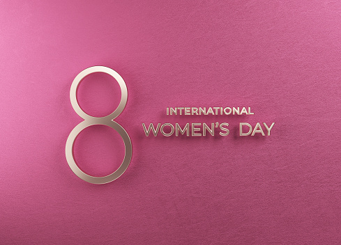 Women's day concept golden number eight and international women's day text on pink color background