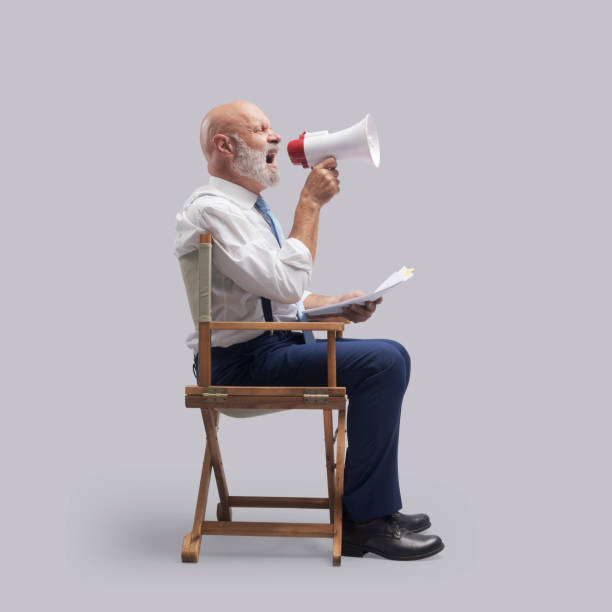 istock Filmmaker shouting with a megaphone 1465781835