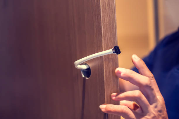 istock Selective focus to wooden door with blurry cable of digital door lock security system. 1465783297