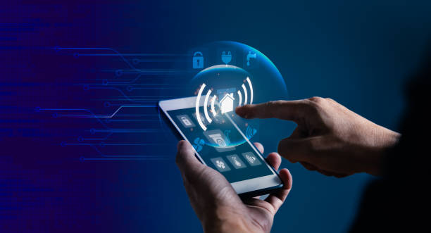 istock Mobile phone with smart home app and virtual display as assistant house remote control 1465783592