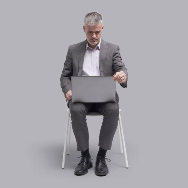 istock Businessman connecting with his laptop 1465783706
