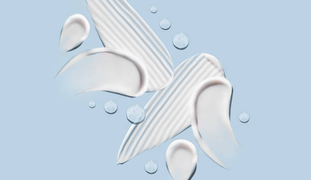 istock cosmetic smears cream texture on pastel blue background 1465783770