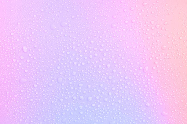 drops on a pastel multi-colored iridescent background - multi vitamine stockfoto's en -beelden