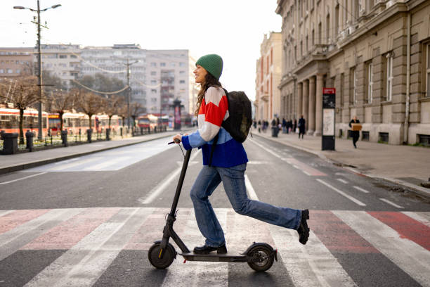 istock Crossing the road on electric push scooter! 1465787487