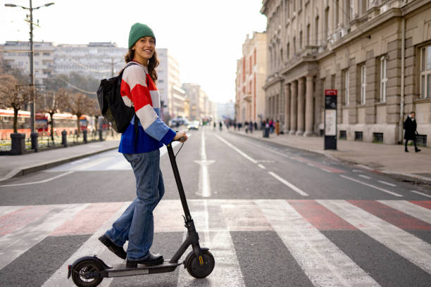 istock Riding electric push scooter on a crosswalk! 1465787492