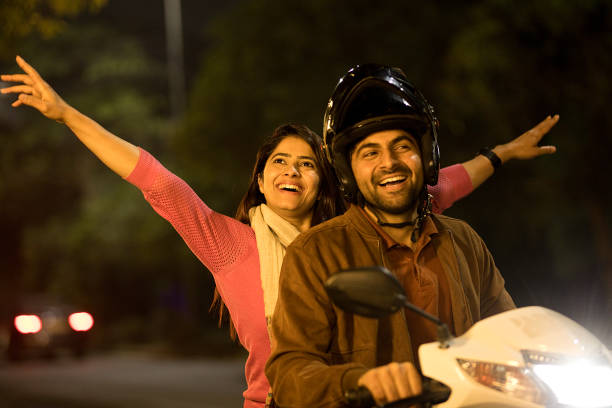 istock Happy couple enjoying motorcycle ride at night 1465787926