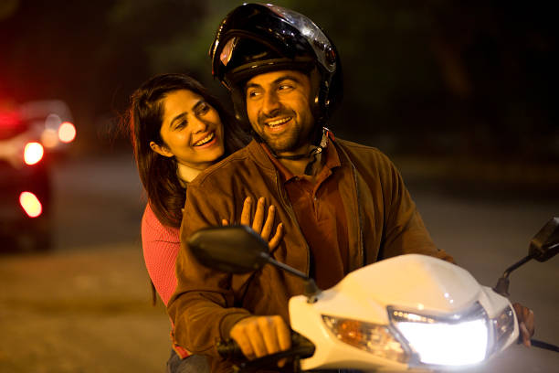 istock Happy couple enjoying motorcycle ride at night 1465788259