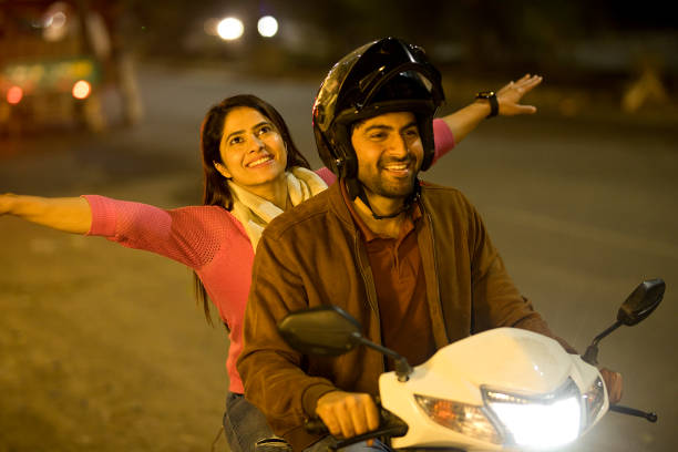 istock Happy couple enjoying motorcycle ride at night 1465788723