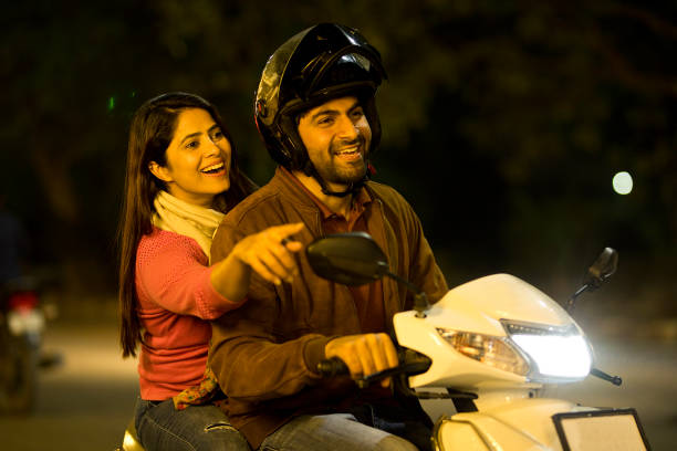 istock Happy couple enjoying motorcycle ride at night 1465789046