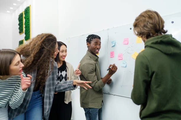 istock Creative business team reading the sticky notes and discussing. 1465789669