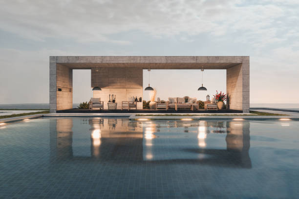 lounge interior with sofa and armchairs by the pool - swimming pool luxury mansion holiday villa imagens e fotografias de stock