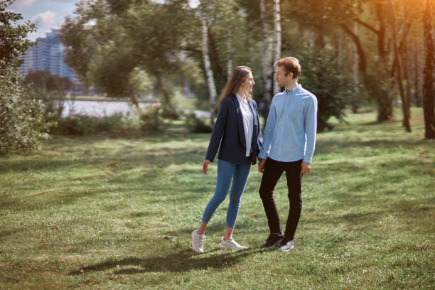 happy couple in love chatting while walking . love story.