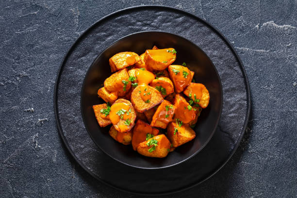 istock patatas bravas, deep fried potatoes with sauce 1465793933