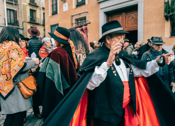 December 18th 2022, Madrid,Spain: People dancing to Flamenco music at Mayor Square in Madrid for Zambomba Festival during Christmas. It is a celebration during Christmas which flamenco style carols are sung in the streets of different towns in Spain.The name comes from the typical instrument used at Christmas time, which accompanies popular canticles and Christmas carols since old times.It is a kind of improvised percussive instrument, which used to be made from a clay flowerpot or a paint tin. Over the pot, a piece of leather is stretched and a cane or a stick inserted through the skin. The up-and-down movement of the stick creates the characteristic droning sound of the Zambomba.