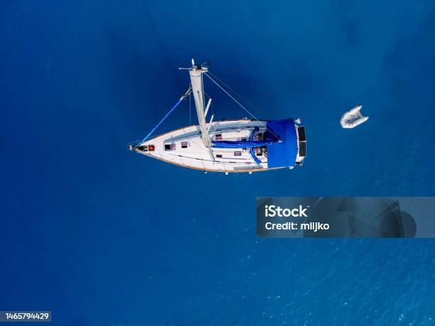 Sailboat Moored On Blue Sea View From Above Stock Photo - Download Image Now - Lefkada Island, Aerial View, Beauty In Nature