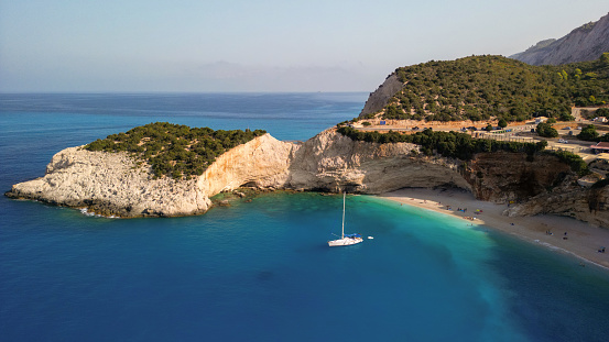 Sailboat anchored in bay of Porto Katsiki beach. This beach is famous mostly because of crystal clear water and because of their amazing color. Lefkada island, Greece
