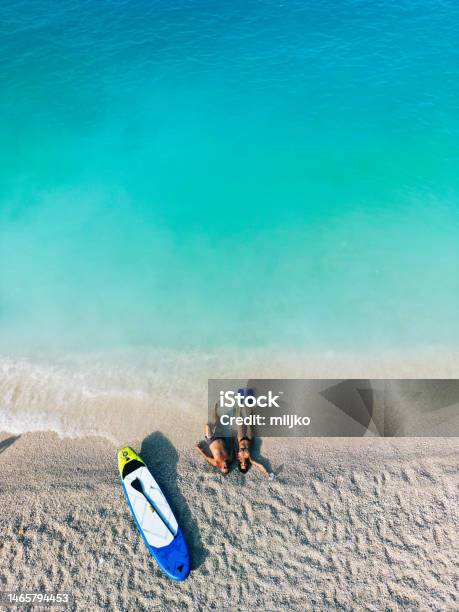 Mature Couple Enjoying Their Vacation On Seaside Stock Photo - Download Image Now - Beach, Greece, Couple - Relationship
