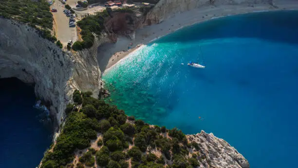 Sailboat anchored in bay of Porto Katsiki beach. This beach is famous mostly because of crystal clear water and because of their amazing color. Lefkada island, Greece