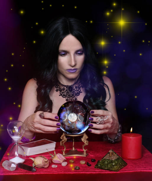 istock Psychic with crystal ball and tarot cards Bright Galaxy Background 1465794889
