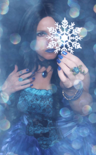 istock Gothic female with snowflake ornament and blue bokeh 1465797462
