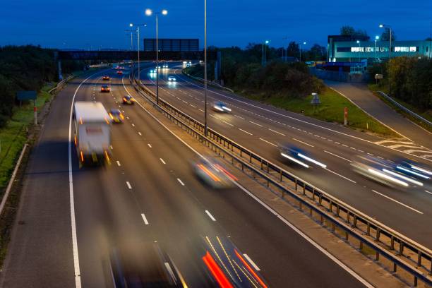 istock Speeding traffic driving along the M5 motorway at night. 1465799563