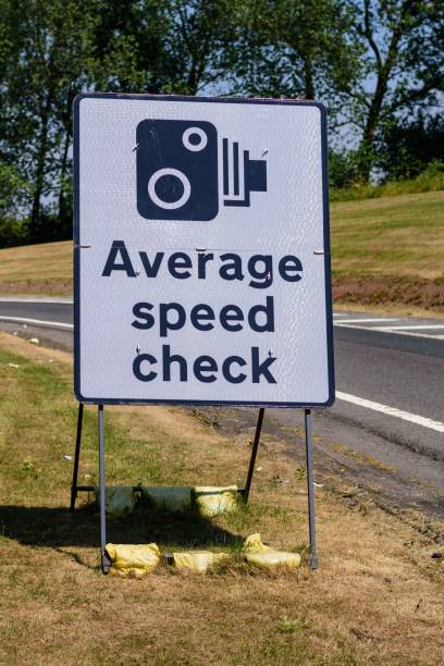 istock Average speed check sign at the exit of a motorway services area on UK highway. 1465801276