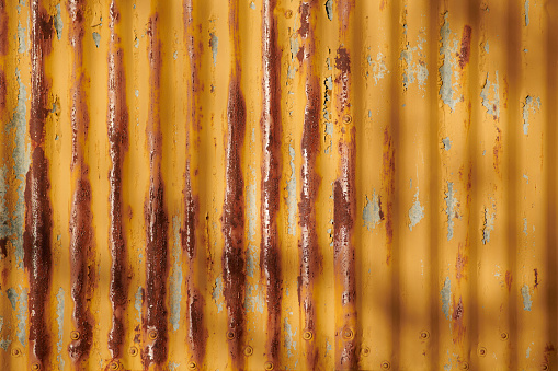 Photograph of a metal panel as a cladding of an old industrial building.