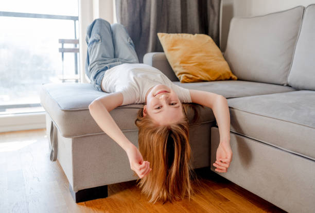 istock Preteen girl lying on sofa and posing 1465802127