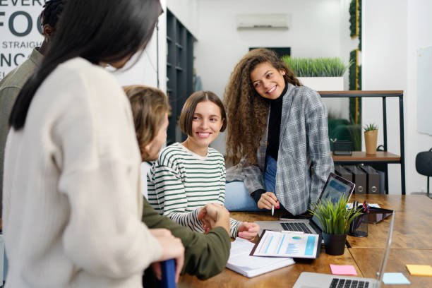 istock close-up. young managers crew working with project. Business coworking. 1465802845
