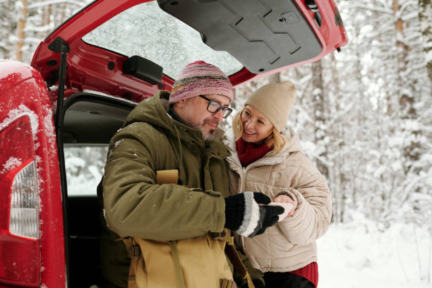 istock Mature man looking through new trip photos on smartphone screen 1465804102