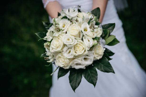 istock Closeup shot on the bride's bouquet in her hands 1465805381