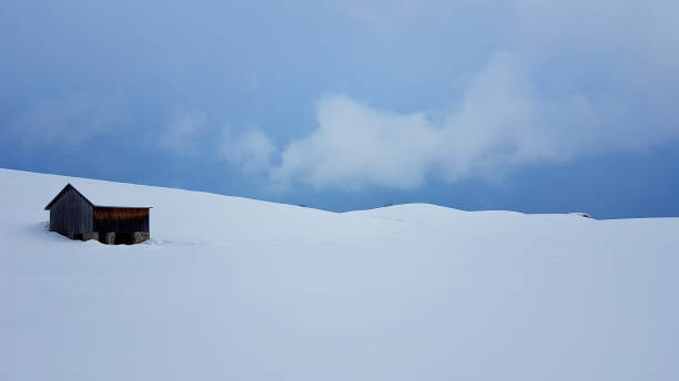 istock Small wooden house in a snowy mountain 1465805845