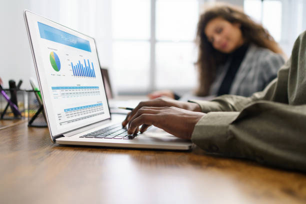 istock business man using a laptop to check financial data. 1465806942