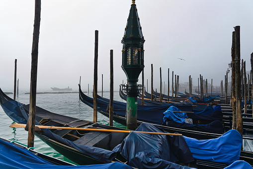 Gondolas at Piazza San Marco on foggy Winterday