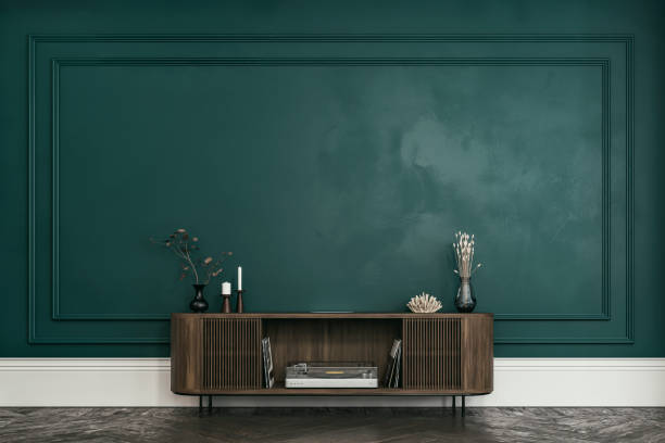 Classic elegant interior - a front and large view of an entrance hall with a french style antique wall background, low cabinet, decoration, and copy space stock photo