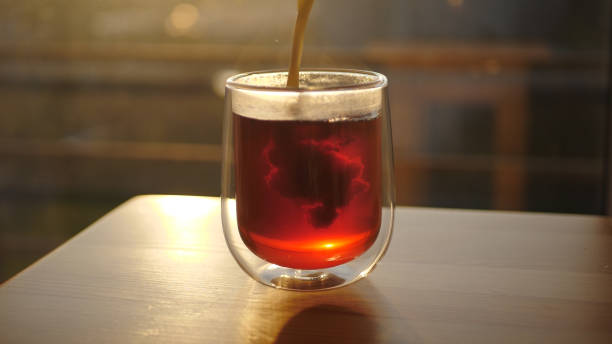 istock Pouring Milk into a Cup of Tea 1465812114
