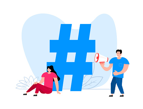 A man and a woman are standing near Hashtag