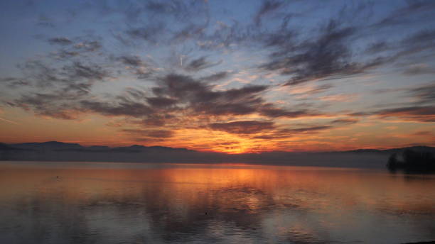 istock Breathtaking view of sunset on water 1465815807