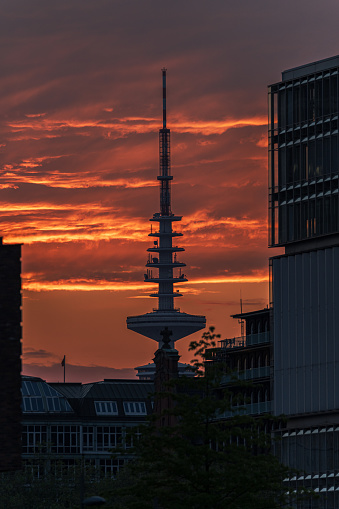 A vertical shot of Televisiontower Hamburg ( Heinrich-Hertz-Turm, Telemichel ) at sunset with epic clouds