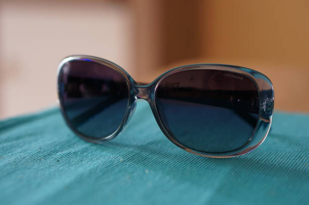 istock Closeup shot of sunglasses on a fabric surface 1465818666