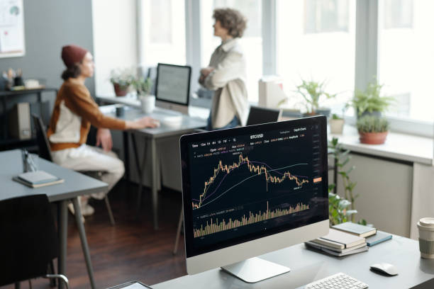 istock Computer monitor with graphic financial statistics on screen 1465820482