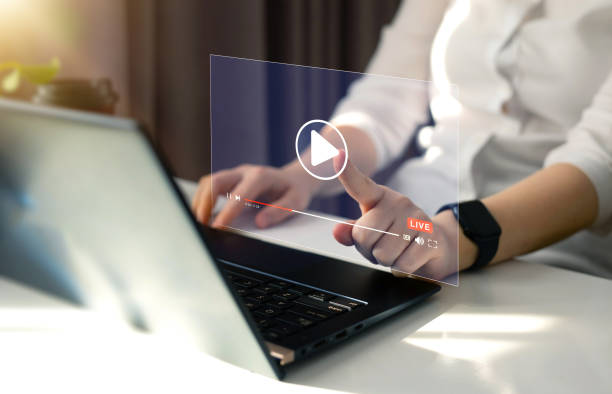 istock Woman watching a live stream.Online live stream window. Video streaming on internet concept. Live digital stream multimedia player. 1465822593