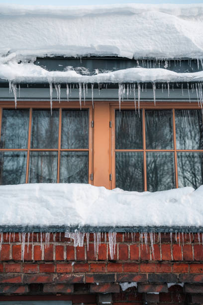 istock Icicles hanging on a house window during winter 1465826701