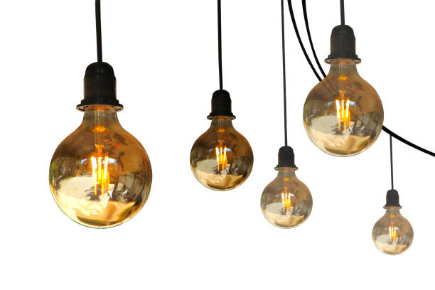 istock Five electric light bulbs hanging from wires isolated on a white background. 1465827149