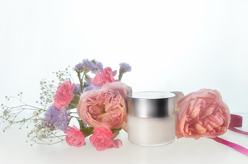 Skin Lotion and Cream with Flowers/Studio Shot