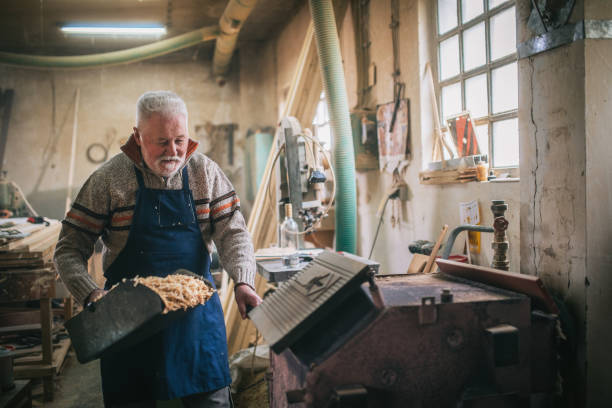 istock Putting a log into a wood burning stove 1465828695