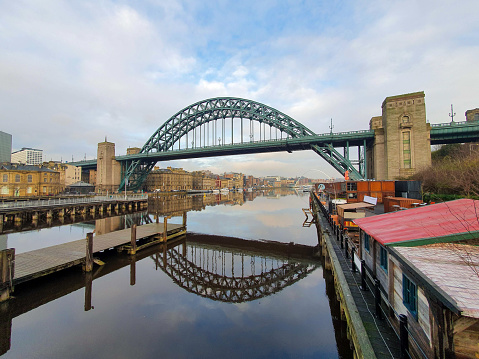 A near perfect reflection of the Tyne bridge in Newcastle and Gateshead with millennium bridge in the background