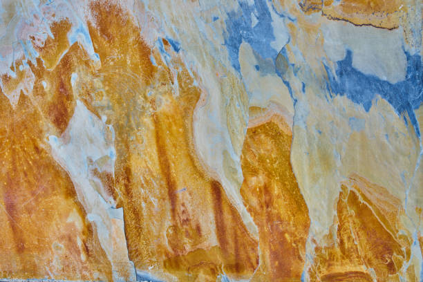 istock Rough stone texture with rust in blue and yellow colors with orang 1465829207
