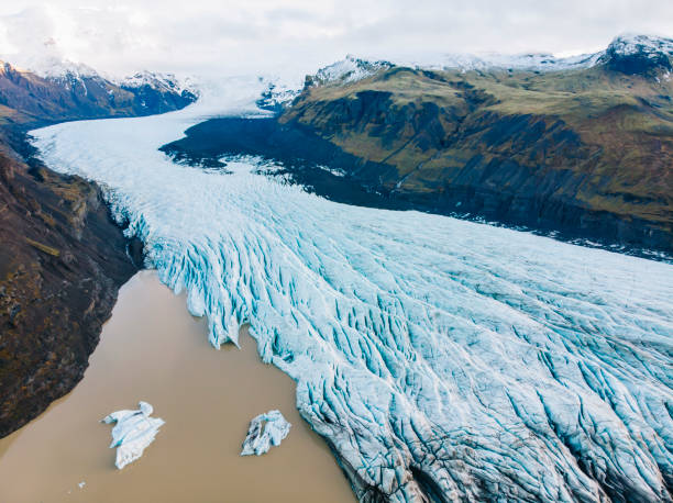 istock Aerial shot of a surface covered in ice on a cl day 1465830176
