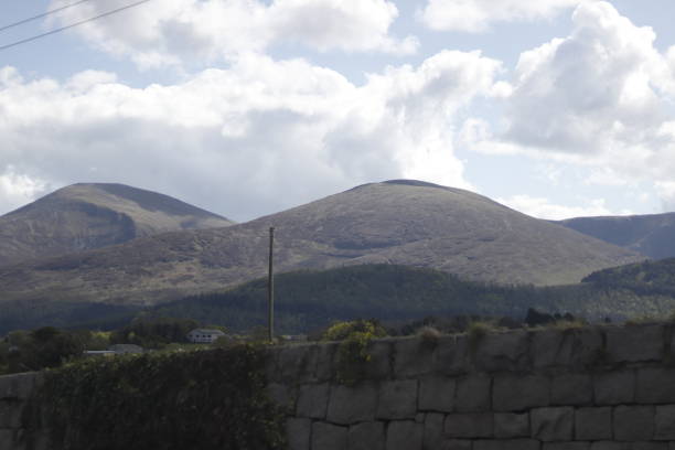 Old wall on the mountains background